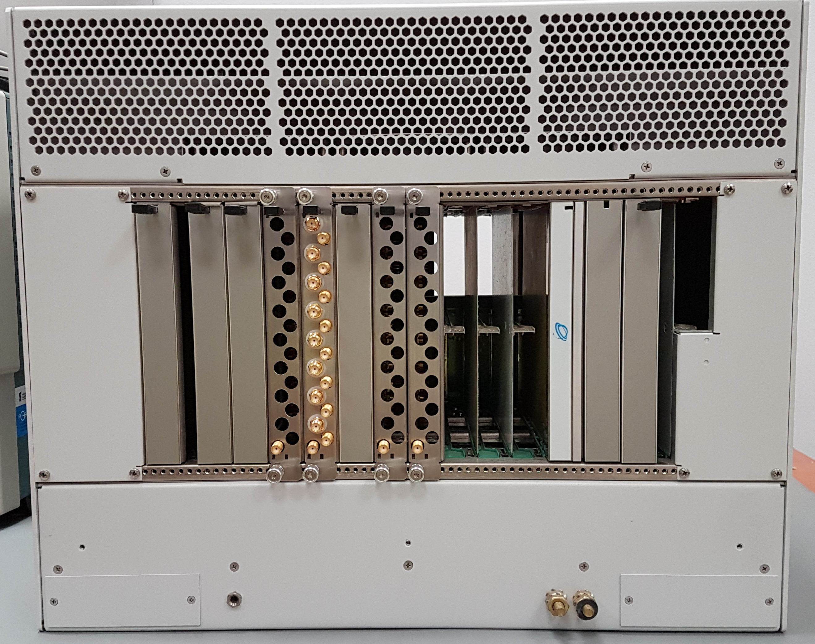 Micro TCA chassis with 4 RTM modules inserted. One of them has 4 BaseMod AFE mezzanines installed.